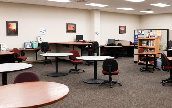 Several round tables where students can study or get academic assistance